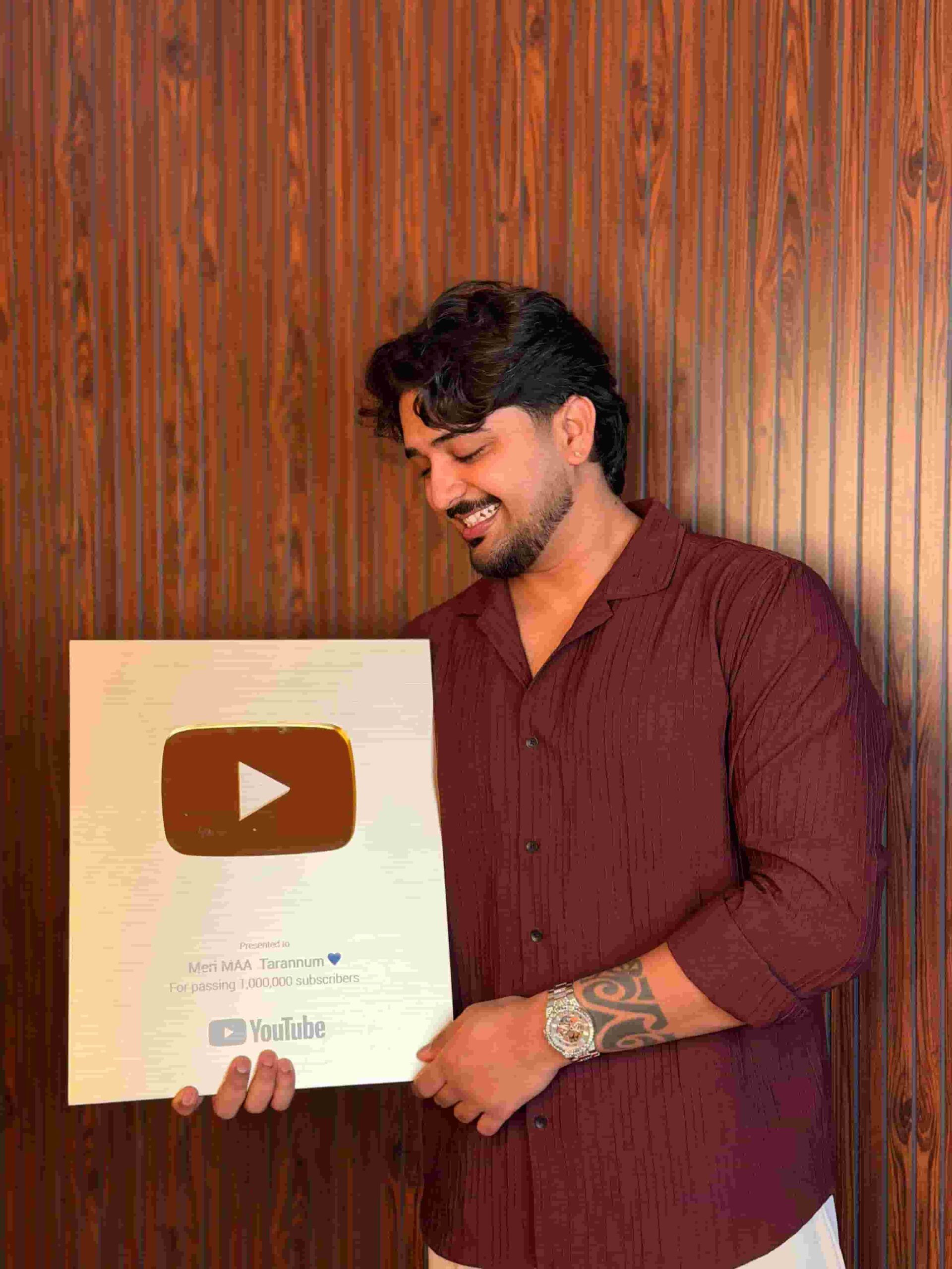 Shane Edwin with a YouTube Play Button